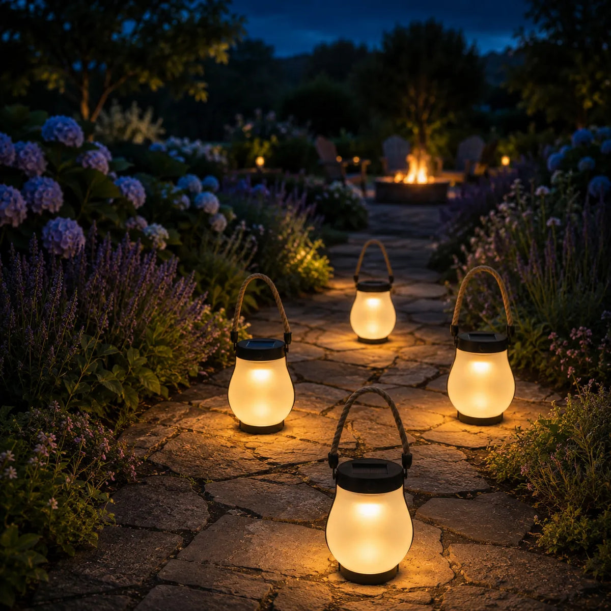 Lumvera lanterns arranged along a garden at dusk