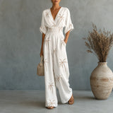 Solene – Printed V-Neck Wide-Leg Jumpsuit with Cinched Waist and Pockets