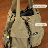 Carryall – Convertible Drawstring Canvas Tote Backpack with Cargo Pockets