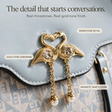 Velora – Swan-Clasp Structured Crossbody Bag with Gold Hardware