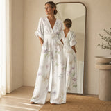 Solene – Printed V-Neck Wide-Leg Jumpsuit with Cinched Waist and Pockets