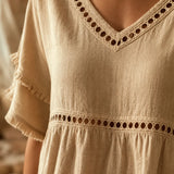 Meloria – Bohemian Babydoll Top with Eyelet Cutouts and Fringe Hem