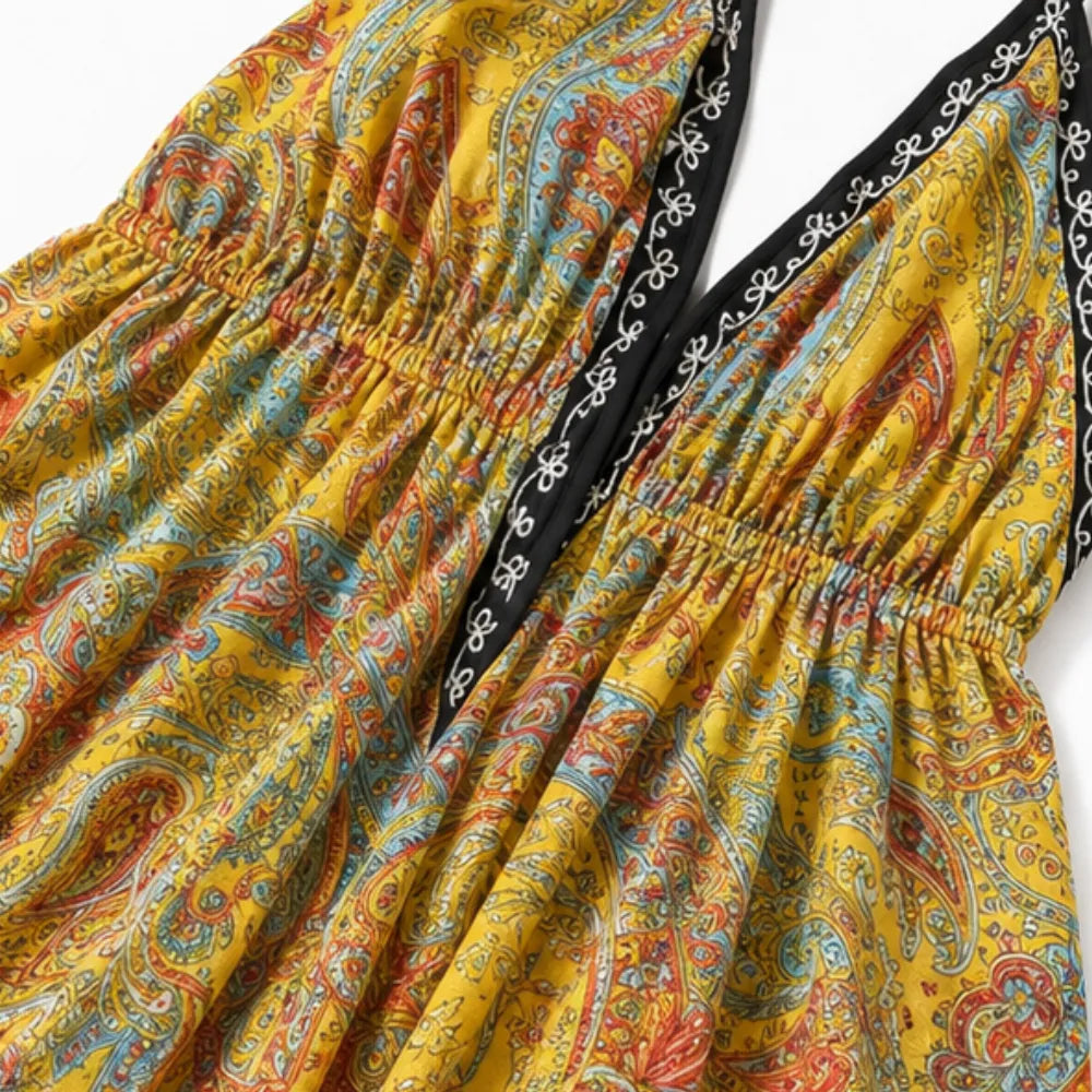 Solivia – Boho paisley halter maxi dress with open back and handkerchief hem
