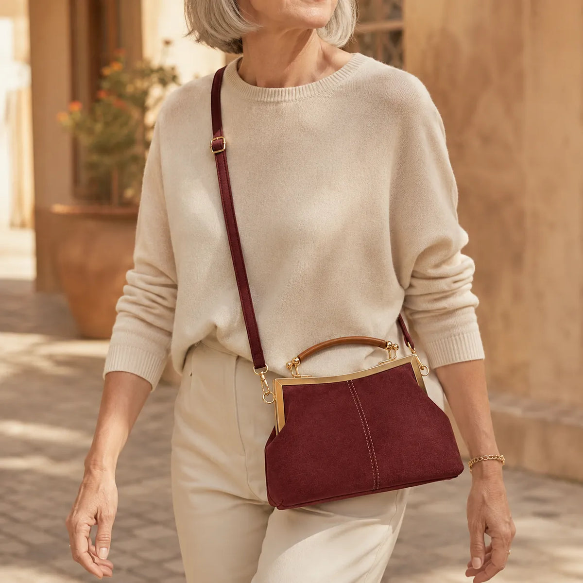 Marelli – Suede-look shell bag with gold tone-frame clasp and crossbody strap
