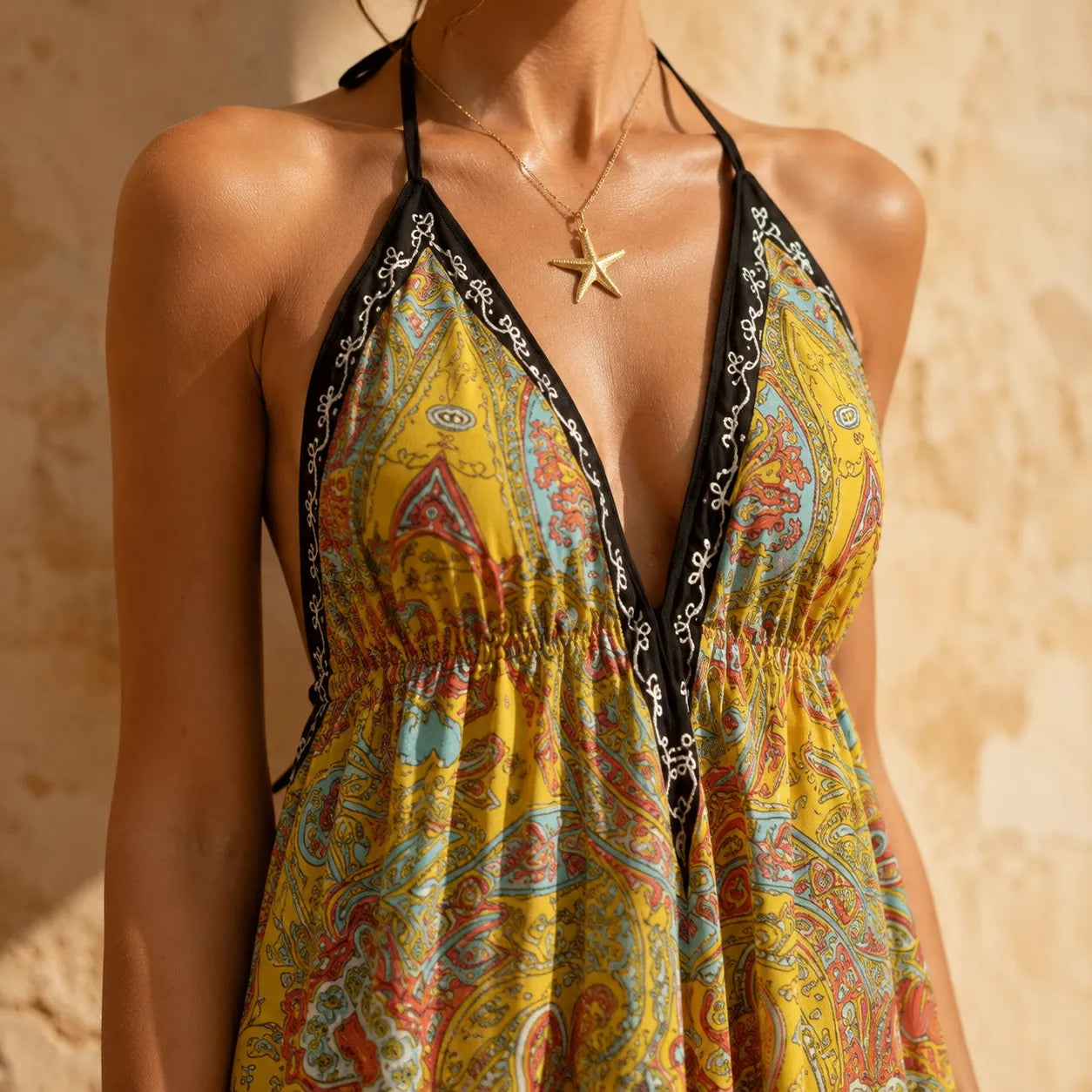 Solivia – Boho paisley halter maxi dress with open back and handkerchief hem