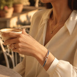 Sereva – Art Deco Sapphire Look Tennis Bracelet with Diamond-Look Clasp, Silver-Tone