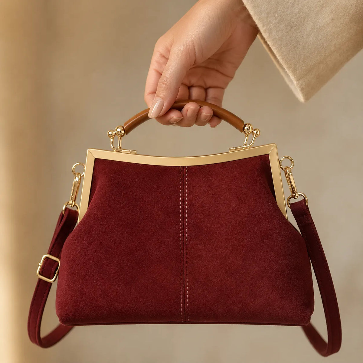 Marelli – Suede-look shell bag with gold tone-frame clasp and crossbody strap