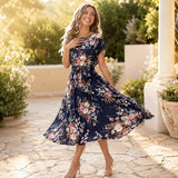 Florenza – Floral Pleated Midi Dress with Tie Waist and Flutter Sleeves