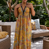Solivia – Boho paisley halter maxi dress with open back and handkerchief hem